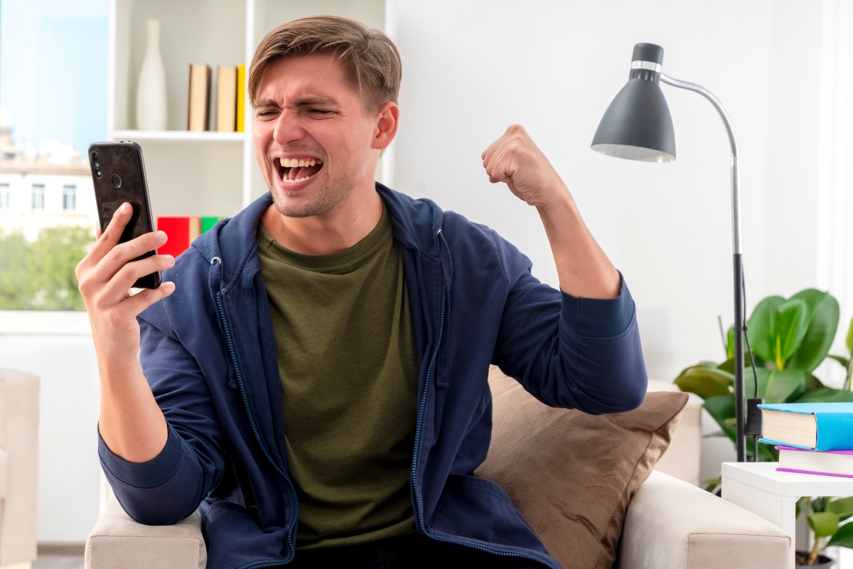 An excited man checking the SGP results. 